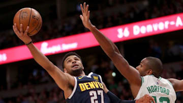 DENVER, CO - NOVEMBER 05: Jamal Murray #27 of the Denver Nuggets drives to the basket against Al Horford #42 of the Boston Celtics in the first quarter at the Pepsi Center on November 5, 2018 in Denver, Colorado. NOTE TO USER: User expressly acknowledges and agrees that, by downloading and or using this photograph, User is consenting to the terms and conditions of the Getty Images License Agreement. (Photo by Matthew Stockman/Getty Images)