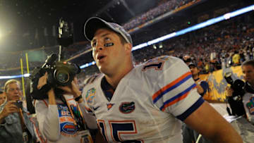 Florida quarterback Tim Tebow runs around Dolphin Stadium shaking hands with Florida fans following the Gators' 24-14 victory over Oklahoma at Dolphins Stadium to win the BCS Championship Game in 2009.Xxx Jg 35673 Bcs 1 7 2009 Jg 35673 Bcs 1 7 2009 Jmg4448 Jpg S Fbc Usa Fl
