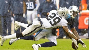 Nov 29, 2015; Nashville, TN, USA; Oakland Raiders cornerback David Amerson (29) breaks up a pass intended for Tennessee Titans wide receiver Dorial Green-Beckham (17) during the second half at Nissan Stadium. Oakland won 24-21. Mandatory Credit: Jim Brown-USA TODAY Sports