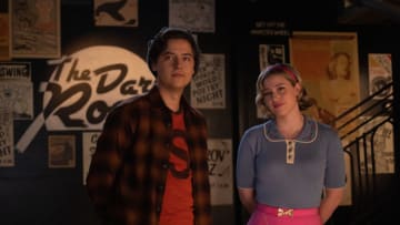Riverdale -- “Chapter One Hundred Thirty-Seven: Goodbye, Riverdale” -- Image Number: RVD720c_0203r -- Pictured (L - R): Cole Sprouse as Jughead Jones and Lili Reinhart as Betty Cooper -- Photo: Justine Yeung/The CW -- © 2023 The CW Network, LLC. All Rights Reserved.
