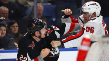 Feb 26, 2023; Buffalo, New York, USA; Buffalo Sabres right wing Jack Quinn (22) and Washington Capitals right wing Nicolas Aube-Kubel (96) fight during the second period at KeyBank Center. Mandatory Credit: Timothy T. Ludwig-USA TODAY Sports