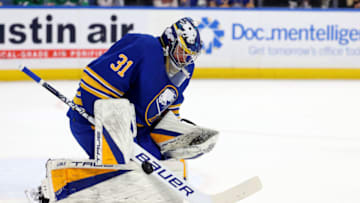 Mar 9, 2023; Buffalo, New York, USA; Buffalo Sabres goaltender Eric Comrie (31) makes a save during the first period against the Dallas Stars at KeyBank Center. Mandatory Credit: Timothy T. Ludwig-USA TODAY Sports