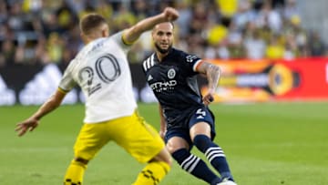 Jul 17, 2021; Columbus, Ohio, USA; New York City FC defender Maxime Chanot (4) sends the ball past Columbus Crew midfielder Alexandru Matan (20) in the first half at Lower.com Field. Mandatory Credit: Greg Bartram-USA TODAY Sports