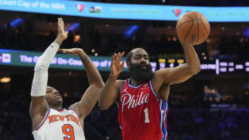 PHILADELPHIA, PA - MARCH 02: James Harden #1 of the Philadelphia 76ers passes the ball against RJ Barrett #9 of the New York Knicks at the Wells Fargo Center on March 2, 2022 in Philadelphia, Pennsylvania. The 76ers defeated the Knicks 123-108. NOTE TO USER: User expressly acknowledges and agrees that, by downloading and or using this photograph, User is consenting to the terms and conditions of the Getty Images License Agreement. (Photo by Mitchell Leff/Getty Images)