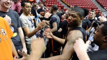 Mar 20, 2014; San Diego, CA, USA; Oklahoma State Cowboys guard Marcus Smart greets fans and signs autographs during practice before the second round of the 2014 NCAA Tournament at Viejas Arena. Mandatory Credit: Robert Hanashiro-USA TODAY Sports