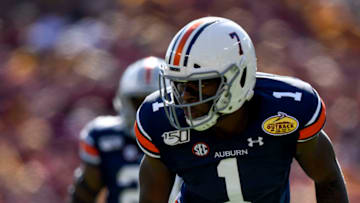 Jan 1, 2020; Tampa, Florida, USA; Auburn Tigers defensive end Big Kat Bryant (1) awaits the snap during the first quarter against the Minnesota Golden Gophers at Raymond James Stadium. Mandatory Credit: Douglas DeFelice-USA TODAY Sports