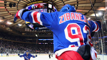 NEW YORK, NEW YORK - MARCH 05: Mika Zibanejad #93 of the New York Rangers scores his fifth goal of the game in overtime defeat the Washington Capitals 5-4 and is joined by Tony DeAngelo #77 at Madison Square Garden on March 05, 2020 in New York City. (Photo by Bruce Bennett/Getty Images)