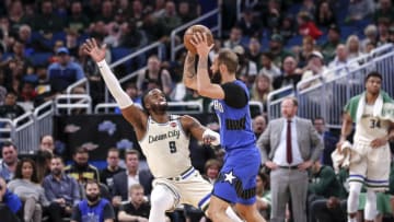 ORLANDO, FL - FEBRUARY 8: Wesley Matthews#9 of the Milwaukee Bucks defends Evan Fournier #10 of the Orlando Magic during the game at the Amway Center on February 8, 2020 in Orlando, Florida. The Bucks defeated the Magic 111 to 95. NOTE TO USER: User expressly acknowledges and agrees that, by downloading and or using this photograph, User is consenting to the terms and conditions of the Getty Images License Agreement. (Photo by Don Juan Moore/Getty Images)