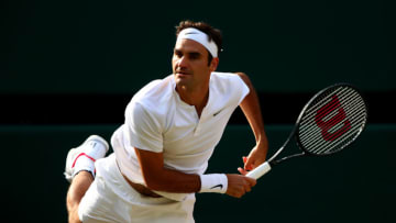 LONDON, ENGLAND - JULY 12: Roger Federer of Switzerland serves during the Gentlemen's Singles quarter final match against Milos Raonic of Canada on day nine of the Wimbledon Lawn Tennis Championships at the All England Lawn Tennis and Croquet Club on July 12, 2017 in London, England. (Photo by Clive Brunskill/Getty Images)