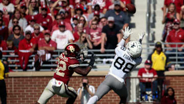 Oct 19, 2019; Norman, OK, USA; West Virginia Mountaineers wide receiver Isaiah Esdale (88) makes a catch past Oklahoma Sooners safety Delarrin Turner-Yell (32) during the fourth quarter at Gaylord Family - Oklahoma Memorial Stadium. Mandatory Credit: Kevin Jairaj-USA TODAY Sports