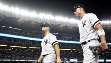 NEW YORK, NEW YORK - JULY 18: Brett Gardner #11 (L) and Aaron Judge #99 of the New York Yankees walk toward the dugout during the fifth inning of game two of a doubleheader against the Tampa Bay Rays at Yankee Stadium on July 18, 2019 in the Bronx borough of New York City. (Photo by Sarah Stier/Getty Images)