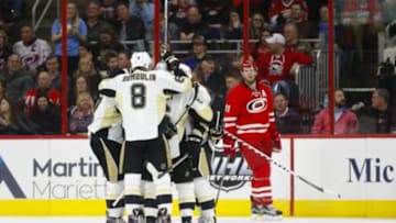 Feb 12, 2016; Raleigh, NC, USA; Pittsburgh Penguins forward Phil Kessel (81) celebrates his second period goal with teammates against the Carolina Hurricanes at PNC Arena. Mandatory Credit: James Guillory-USA TODAY Sports
