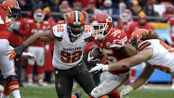 Dec 27, 2015; Kansas City, MO, USA; Kansas City Chiefs running back Charcandrick West (35) carries the ball against Cleveland Browns defensive end Desmond Bryant (92) and outside linebacker Paul Kruger (99) in the first half at Arrowhead Stadium. Kansas City won the game 17-13. Mandatory Credit: John Rieger-USA TODAY Sports