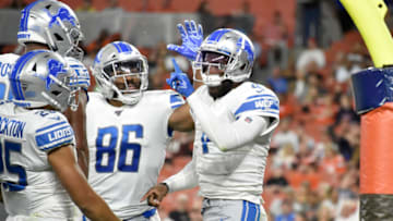 CLEVELAND, OHIO - AUGUST 29: Tight end Jerome Cunningham #86 celebrates with quarterback Josh Johnson #4 of the Detroit Lions after Johnson ran in a touchdown during the second half of a preseason game against the Cleveland Browns at FirstEnergy Stadium on August 29, 2019 in Cleveland, Ohio. The Browns defeated the Lions 20-16. (Photo by Jason Miller/Getty Images)