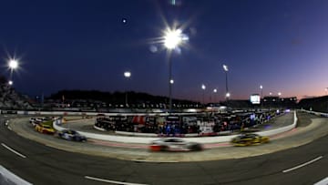 MARTINSVILLE, VA - OCTOBER 29: Cars race under the lights during the Monster Energy NASCAR Cup Series First Data 500 at Martinsville Speedway on October 29, 2017 in Martinsville, Virginia. (Photo by Sarah Crabill/Getty Images)