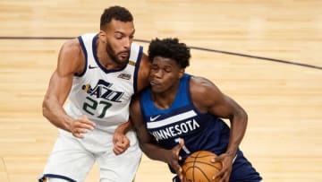 Rudy Gobert of the Utah Jazz defends against Anthony Edwards of the Minnesota Timberwolves. (Photo by Hannah Foslien/Getty Images)