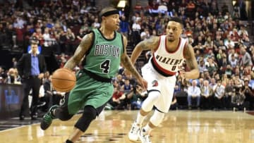 Mar 31, 2016; Portland, OR, USA; Boston Celtics guard Isaiah Thomas (4) dribbles the ball in front of Portland Trail Blazers guard Damian Lillard (0) during the first quarter at the Moda Center at the Rose Quarter. Mandatory Credit: Steve Dykes-USA TODAY Sports