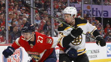 SUNRISE, FL - APRIL 28: Charlie McAvoy #73 of the Boston Bruins defends against Eetu Luostarinen #27 of the Florida Panthers as he skates into the corner after the puck in Game Six of the First Round of the 2023 Stanley Cup Playoffs at the FLA Live Arena on April 28, 2023 in Sunrise, Florida. (Photo by Joel Auerbach/Getty Images)
