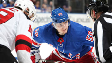 NEW YORK, NY - FEBRUARY 23: Lias Andersson #50 of the New York Rangers takes a face-off against the New Jersey Devils at Madison Square Garden on February 23, 2019 in New York City. (Photo by Jared Silber/NHLI via Getty Images)
