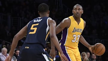 Dec 5, 2016; Los Angeles, CA, USA; Los Angeles Lakers forward Metta World Peace (37) handles the ball against Utah Jazz guard Rodney Hood (5) during the first quarter at Staples Center. Mandatory Credit: Richard Mackson-USA TODAY Sports