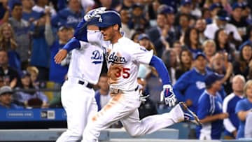 LOS ANGELES, CA - MAY 30: Cody Bellinger #35 of the Los Angeles Dodgers rounds third to score on a single by Ross Stripling #68 of the Los Angeles Dodgers in the fifth inning of the game against the Philadelphia Phillies at Dodger Stadium on May 30, 2018 in Los Angeles, California. (Photo by Jayne Kamin-Oncea/Getty Images)