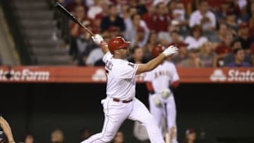 Jul 20, 2015; Anaheim, CA, USA; Los Angeles Angels first baseman Albert Pujols (5) follows through on a swing for a solo home run against the Boston Red Sox during the seventh inning at Angel Stadium of Anaheim. Mandatory Credit: Kelvin Kuo-USA TODAY Sports