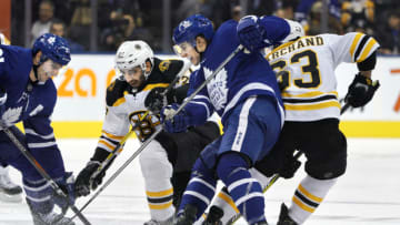 TORONTO, ON - JANUARY 12: Toronto Maple Leafs Center John Tavares (91) and teammate Toronto Maple Leafs Right Wing Mitchell Marner (16) battle Boston Bruins Center Patrice Bergeron (37) for the puck during the regular season NHL game between the Boston Bruins and Toronto Maple Leafs on January 12, 2019 at Scotiabank Arena in Toronto, ON. (Photo by Jeff Chevrier/Icon Sportswire via Getty Images)