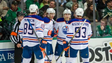Nov 25, 2014; Dallas, TX, USA; Edmonton Oilers defenseman Martin Marincin (85) and left wing Taylor Hall (4) and right wing Jordan Eberle (14) and center Ryan Nugent-Hopkins (93) celebrate Hall