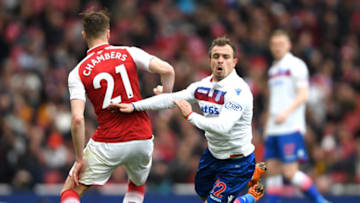 LONDON, ENGLAND - APRIL 01: Calum Chambers of Arsenal fouls Xherdan Shaqiri of Stoke City during the Premier League match between Arsenal and Stoke City at Emirates Stadium on April 1, 2018 in London, England. (Photo by Mike Hewitt/Getty Images)