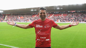 SOUTHAMPTON, ENGLAND - OCTOBER 16: Former Southampton player and charity fundraiser Francis Benali salutes the crowd as he finishes his groundhopping endurance challenge during the Premier League match between Southampton and Burnley at St Mary's Stadium on October 16, 2016 in Southampton, England. Benali's Big Race is raising money for Cancer Research. (Photo by Mike Hewitt/Getty Images)
