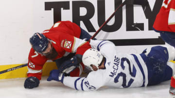 SUNRISE, FL - MAY 10: Jake McCabe #22 of the Toronto Maple Leafs and Radko Gudas #7 of the Florida Panthers battle along the boards in the third period of Game Four of the Second Round of the 2023 Stanley Cup Playoffs at the FLA Live Arena on May 10, 2023 in Sunrise, Florida. (Photo by Joel Auerbach/Getty Images)