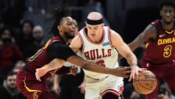 Mar 26, 2022; Cleveland, Ohio, USA; Cleveland Cavaliers guard Darius Garland (10) tries to knock the ball from Chicago Bulls guard Alex Caruso (6) during the first half at Rocket Mortgage FieldHouse. Mandatory Credit: Ken Blaze-USA TODAY Sports