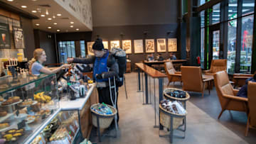 SEATTLE, WASHINGTON - MARCH 10: A Starbucks coffee shop sits mostly empty at Amazon headquarters on March 10, 2020 in downtown Seattle, Washington. In response to the coronavirus outbreak, Amazon recommended all employees in its Seattle headquarters work from home, leaving much of downtown nearly void of people. (Photo by John Moore/Getty Images)