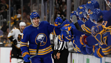 Dec 31, 2022; Boston, Massachusetts, USA; Buffalo Sabres center Dylan Cozens (24) is congratulated at the bench after his game tying goal against the Boston Bruins during the third period at TD Garden. Mandatory Credit: Winslow Townson-USA TODAY Sports