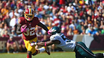 Oct 16, 2016; Landover, MD, USA; Washington Redskins running back Robert Kelley (32) breaks a tackle by Philadelphia Eagles defensive end Brandon Graham (55) during the first half at FedEx Field. Mandatory Credit: Brad Mills-USA TODAY Sports
