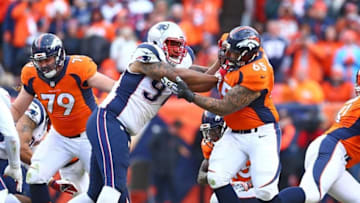 Jan 24, 2016; Denver, CO, USA; Denver Broncos guard Louis Vasquez (65) blocks New England Patriots defensive lineman Alan Branch (97) in the AFC Championship football game at Sports Authority Field at Mile High. The Broncos defeated the Patriots 20-18 to advance to the Super Bowl. Mandatory Credit: Mark J. Rebilas-USA TODAY Sports