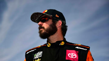 AVONDALE, ARIZONA - NOVEMBER 09: Martin Truex Jr., driver of the #19 Bass Pro Shops Toyota, stands on the grid during qualifying for the Monster Energy NASCAR Cup Series Bluegreen Vacations 500 at ISM Raceway on November 09, 2019 in Avondale, Arizona. (Photo by Jared C. Tilton/Getty Images)
