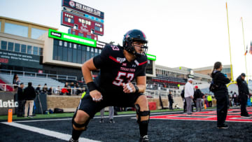 LUBBOCK, TEXAS - NOVEMBER 23: Offensive lineman Trevor Roberson #53 of the Texas Tech Red Raiders warms up before the college football game against the Kansas State Wildcats on November 23, 2019 at Jones AT&T Stadium in Lubbock, Texas. (Photo by John E. Moore III/Getty Images)