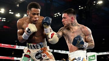 Devin Haney of the US (L) fights with Australia's George Kambosos (R) during their lightweight title boxing match in Melbourne on June 5, 2022. - -- IMAGE RESTRICTED TO EDITORIAL USE - STRICTLY NO COMMERCIAL USE -- (Photo by William WEST / AFP) / -- IMAGE RESTRICTED TO EDITORIAL USE - STRICTLY NO COMMERCIAL USE -- (Photo by WILLIAM WEST/AFP via Getty Images)