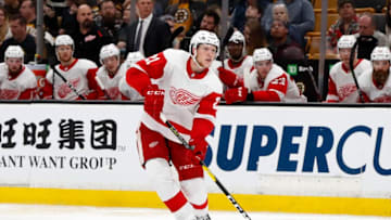 BOSTON, MA - SEPTEMBER 26: Detroit Red Wings defenseman Dennis Cholowski (21) moves the puck on the power play during a preseason game between the Boston Bruins and the Detroit Red Wings on September 26, 2018, at TD Garden in Boston, Massachusetts. The Red Wings defeated the Bruins 3-2 (OT). (Photo by Fred Kfoury III/Icon Sportswire via Getty Images)