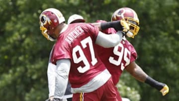 Jun 16, 2015; Ashburn, VA, USA; Washington Redskins defensive end Jason Hatcher (97) celebrates with Redskins defensive end Ricky Jean Francois (99) during a tackling drill as part of day one of Redskins Minicamp at Redskins Park. Mandatory Credit: Geoff Burke-USA TODAY Sports