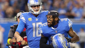 DETROIT, MICHIGAN - SEPTEMBER 18: Jared Goff #16 and D'Andre Swift #32 of the Detroit Lions react after a touchdown against the Washington Commanders during the third quarter at Ford Field on September 18, 2022 in Detroit, Michigan. (Photo by Gregory Shamus/Getty Images)