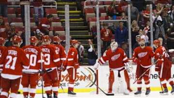 Nov 30, 2014; Detroit, MI, USA; The Detroit Red Wings players celebrate after the game against the Vancouver Canucks at Joe Louis Arena. The Red Wings won 5-3. Mandatory Credit: Rick Osentoski-USA TODAY Sports