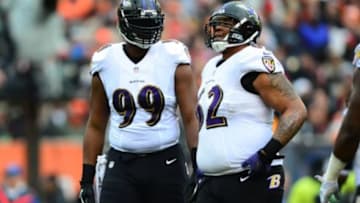 Dec 29, 2013; Cincinnati, OH, USA; Baltimore Ravens defensive end Chris Canty (99) and nose tackle Terrence Cody (62) against the Cincinnati Bengals at Paul Brown Stadium. Bengals defeated the Ravens 34-17. Mandatory Credit: Andrew Weber-USA TODAY Sports