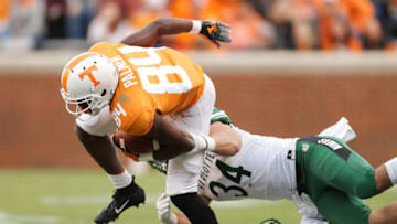 KNOXVILLE, TN - NOVEMBER 3: Wide receiver Josh Palmer #84 of the Tennessee Volunteers runs for yards with Jeff Gemmell #34 of the Charlotte 49ers and Ben DeLuca #28 of the Charlotte 49ers defending during the game between the Charlotte 49ers and the Tennessee Volunteers at Neyland Stadium on November 3, 2018 in Knoxville, Tennessee. Tennessee won the game 14-3. (Photo by Donald Page/Getty Images)