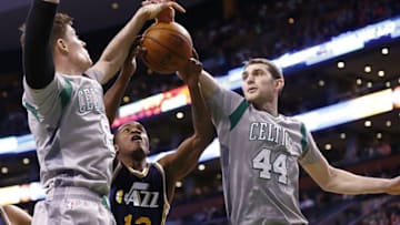 Mar 4, 2015; Boston, MA, USA; Utah Jazz guard Elijah Millsap (13) and Boston Celtics forward Jonas Jerebko (left) and center Tyler Zeller (44) battle for a rebound during the second half at TD Garden. Mandatory Credit: Mark L. Baer-USA TODAY Sports