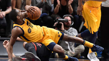 SALT LAKE CITY, UT - DECEMBER 7: Alec Burks #10 of the Utah Jazz falls over Eric Gordon #10 of the Houston Rockets in the second half of the 112-101 win by the Rockets at Vivint Smart Home Arena on December 7, 2017 in Salt Lake City, Utah. NOTE TO USER: User expressly acknowledges and agrees that, by downloading and or using this photograph, User is consenting to the terms and conditions of the Getty Images License Agreement. (Photo by Gene Sweeney Jr./Getty Images)