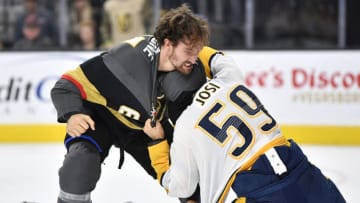 LAS VEGAS, NEVADA - OCTOBER 15: Mark Stone #61 of the Vegas Golden Knights fights Roman Josi #59 of the Nashville Predators during the first period at T-Mobile Arena on October 15, 2019 in Las Vegas, Nevada. (Photo by Jeff Bottari/NHLI via Getty Images)