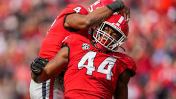 Georgia Bulldogs defensive lineman Travon Walker reacts with linebacker Nolan Smith after a sack against the Missouri Tigers. (Photo by Dale Zanine-USA TODAY Sports)