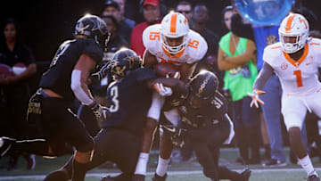 NASHVILLE, TN - NOVEMBER 24: Jauan Jennings #15 of the Tennessee Volunteers is tackled by Tae Daley #3 and Alim Muhammad #31 of the Vanderbilt Commodores during the first half at Vanderbilt Stadium on November 24, 2018 in Nashville, Tennessee. (Photo by Frederick Breedon/Getty Images)